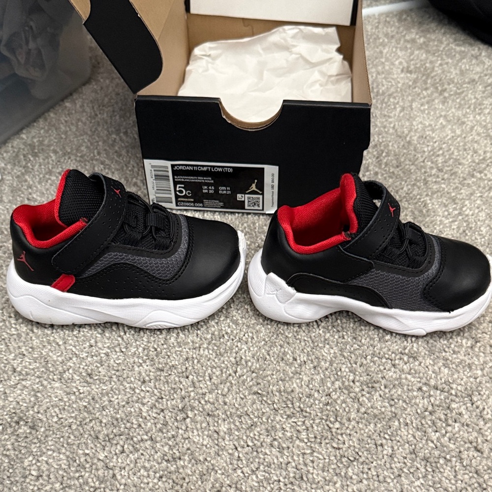 Jordan 11 Kids Black and Red Low-Top Sneakers
